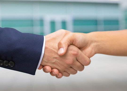 Closeup shot of business handshake. Cropped shot of two people wearing formal suits shaking hands. Business handshake concept